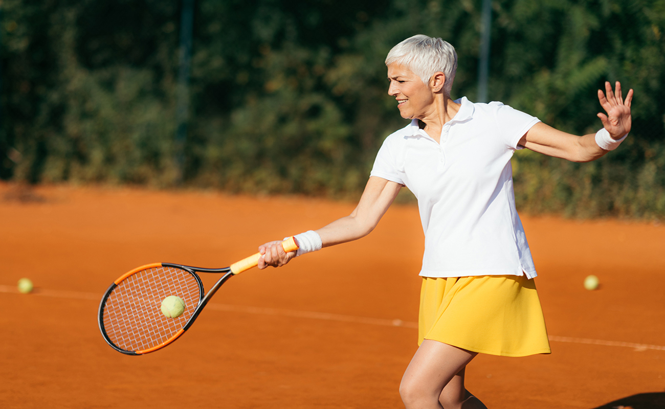 Active Lifestyle Seniors – Positive Mature Woman Playing Tennis Recreationally